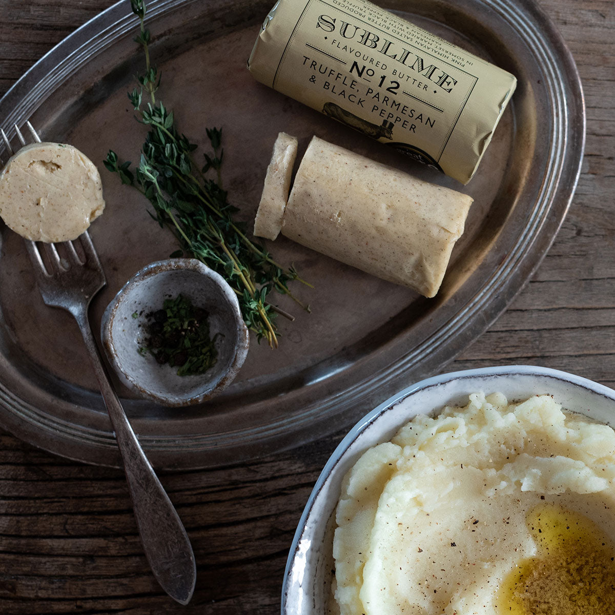 Sublime's Truffle, Parmesan & Black Pepper butter presented alongside creamy mashed potato and thyme