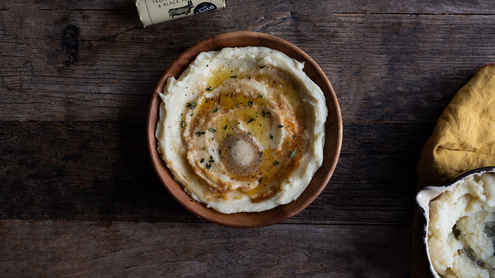 Decadent and creamy mashed potato garnished with thyme and Sublime's truffle, parmesan & black pepper butter